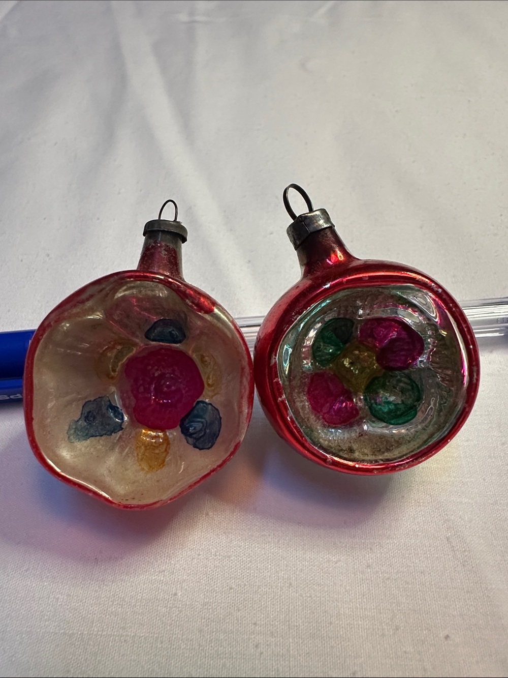 Two mini vintage indent ornaments